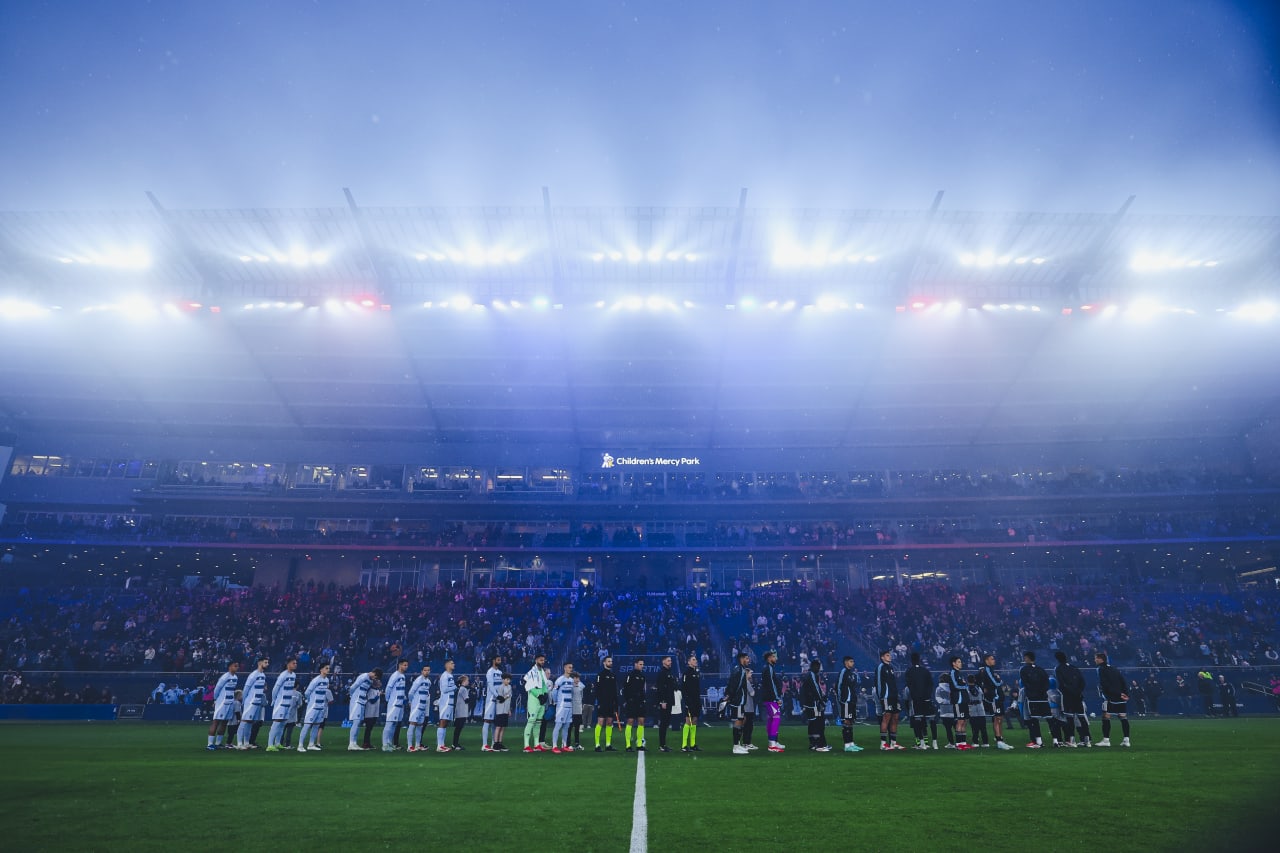 Sporting KC and Minnesota United stand for the National Anthem before the game on Saturday.
