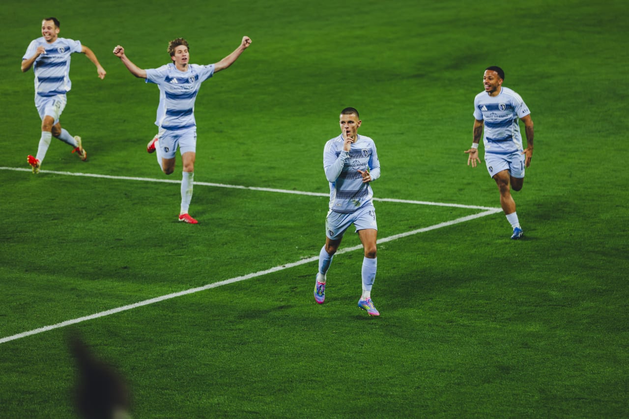 Sporting KC forward Dejan Joveljic celebrates with his double finger gun celebration while being chased by his Sporting KC teammates after scoring his second of the night..